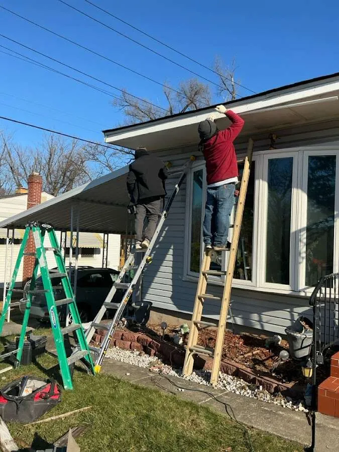 Restoration crew performing exterior repair in Tuttle