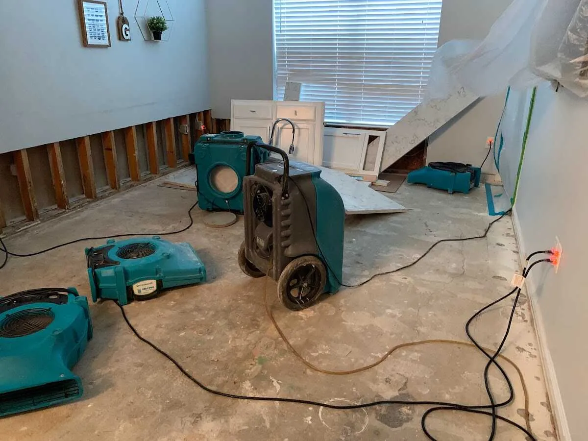 Dehumidifier in flood-cut room for Water Damage Restoration in Tuttle